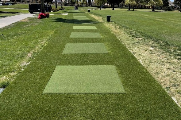 Austin Outdoor tee line with light green synthetic grass boxes inside a dark green synthetic grass strip